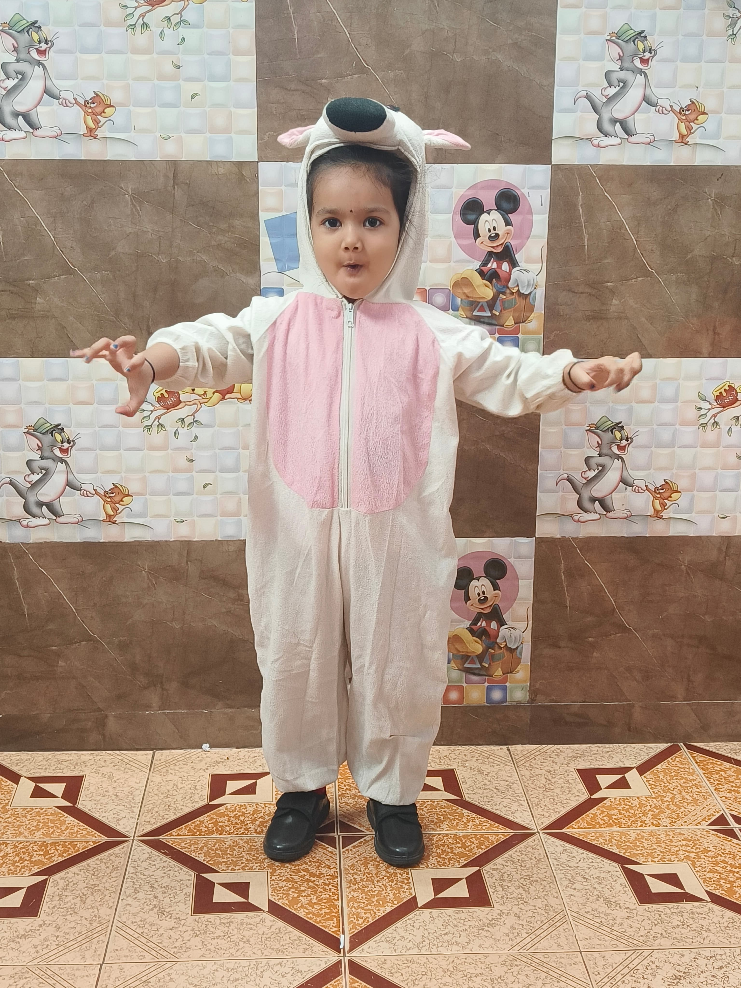 Girl in white and pink dog costume with hood posing on Animal Day
